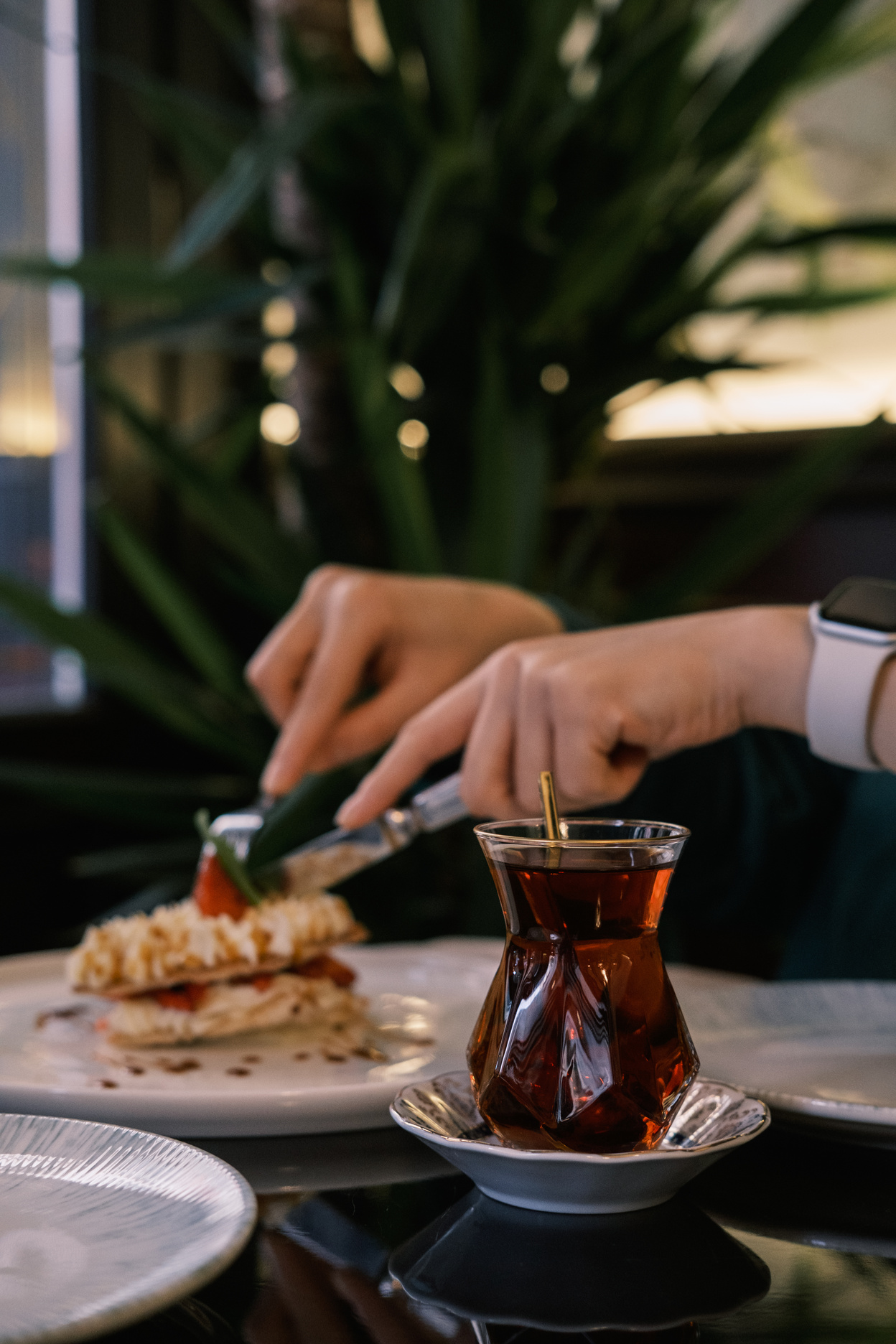 Woman Having Turkish Tea and Pastries